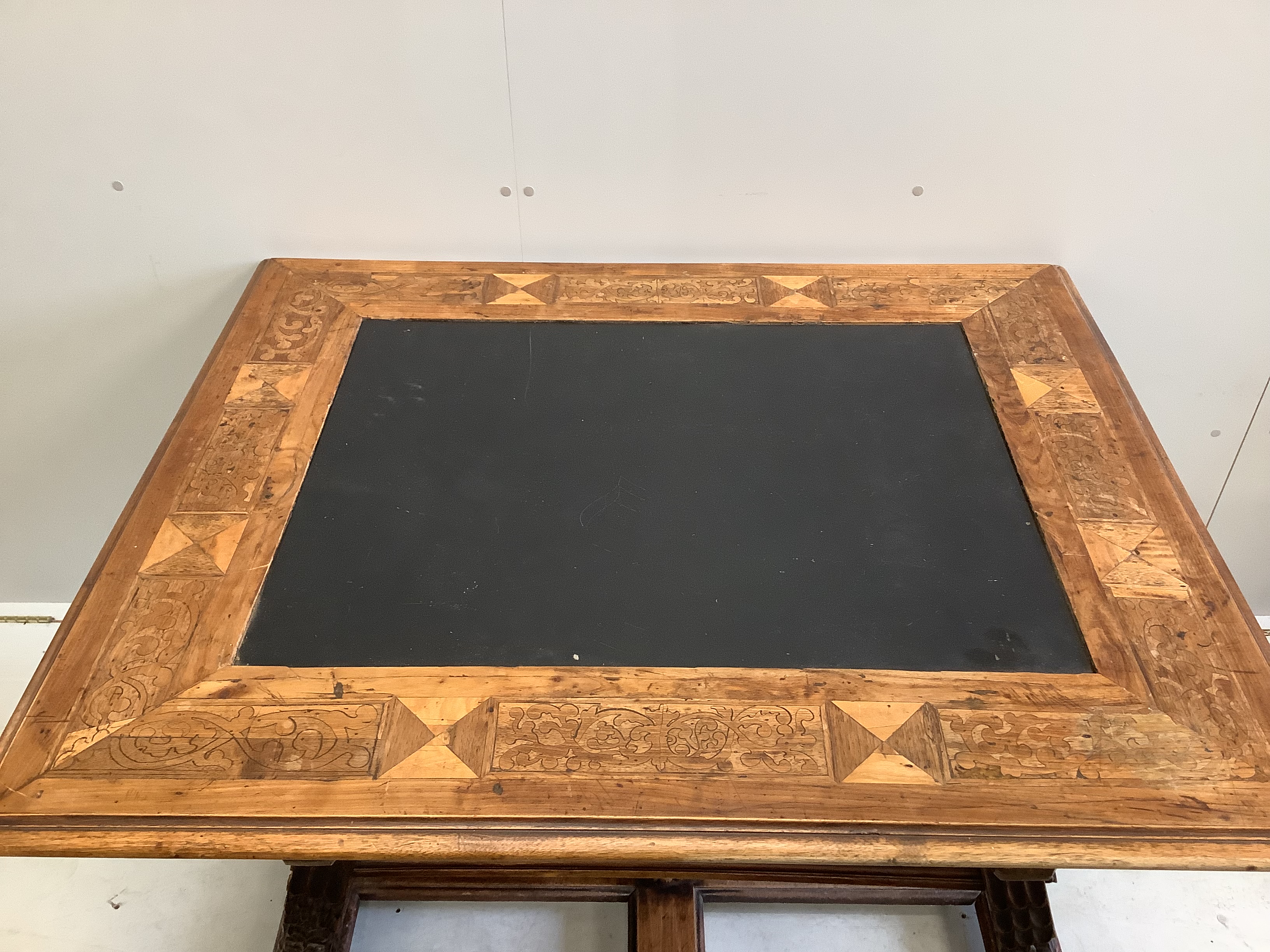 An Italian marquetry inlaid rectangular walnut slate top centre table, width 123cm, depth 104cm, height 79cm